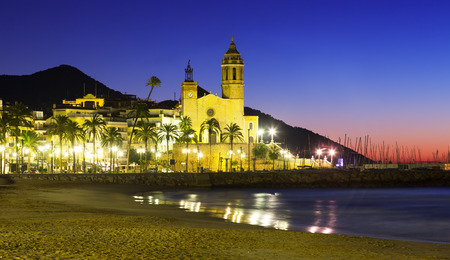 Early morning view of  church at sea beach. Sitgesの写真素材