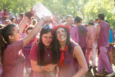 HARO, SPAIN - JUNE 29, 2014: Happy women during Batalla del vino - Haro Wine Festival, La Riojaのeditorial素材