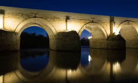 Roman bridge over Guadalquivir river in evening. Cordobaの写真素材