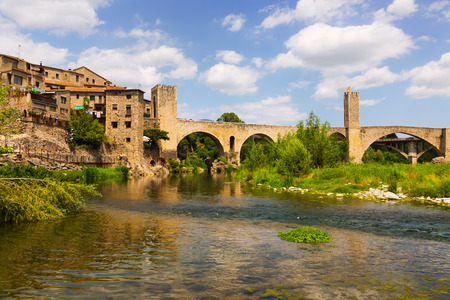 medieval bridge over river. Besalu, Cataloniaの写真素材