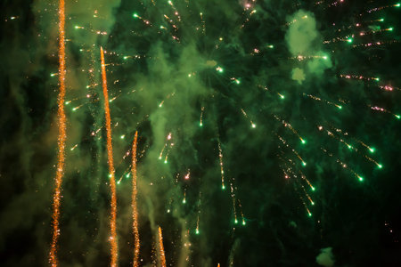 Celebration background. View to fireworks at night sky