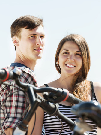 Young couple having rest after cyclingの写真素材