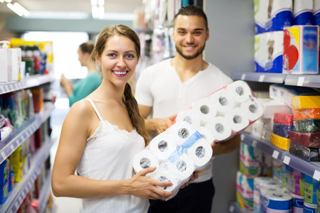 Happy people buying bath tissue in the shopping mallin the shopping mallの写真素材
