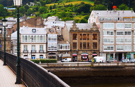 VIVEIRO, SPAIN - JULY 1, 2015: View of Viveiro with bridge over river and dwelling  houses. Lugo, Galicia, Spainのeditorial素材