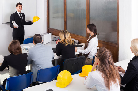 positive european architects having advanced training courses in classroomの写真素材