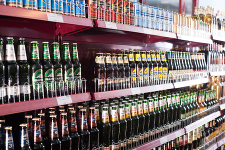 BARCELONA, SPAIN - FEBRUARY 02, 2016: Display with standart  assortment of Russian beer in bottles and cans at East European food storeのeditorial素材