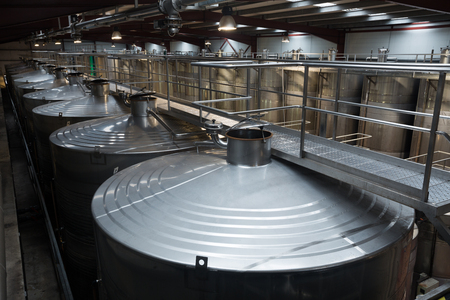 Closeup of equipment of contemporary winery with  stell barrelsのeditorial素材