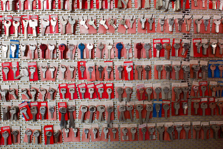 BARCELONA, SPAIN - MARCH 19, 2016: Many new draft keys hanging in the row in the workshop