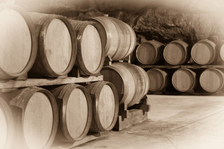 Vintage toned photo  of french winery cellar with  wooden barrelsの写真素材