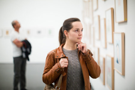 Portrait of adult brunette woman in art museum