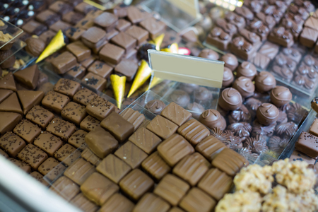 Collection of fine chocolates with different fillings at tea-roomの写真素材