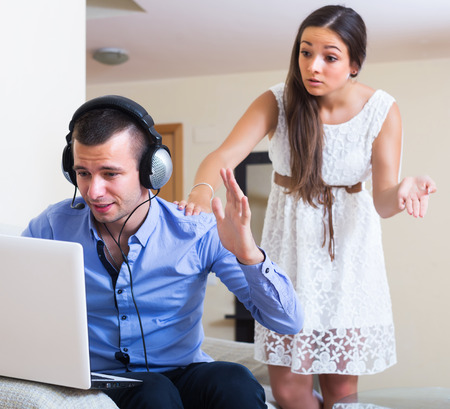 Woman suspecting spouse spending money on games onlineの写真素材