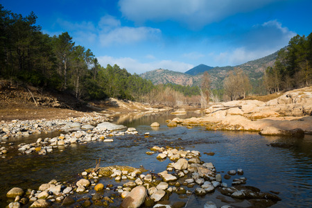 Mountains river under cloudy sky in autumn.  Muga, Catalan Pyrenees. Spainの写真素材