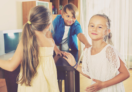 Happy laughing child chasing other kids to tag or touch themの写真素材