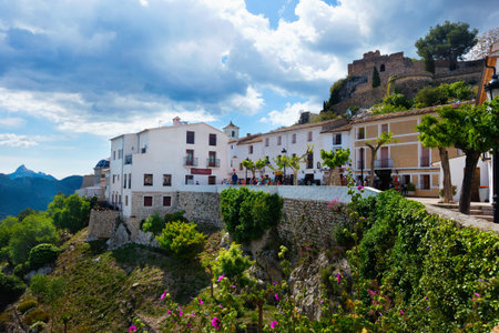 GUADALEST, SPAIN – MAY 15, 2016: Old buildings and streets of Guadalest castle located on top of...