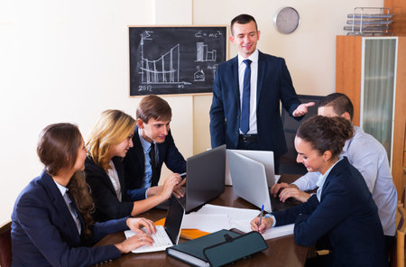 Business meeting of successful team at an office interior
