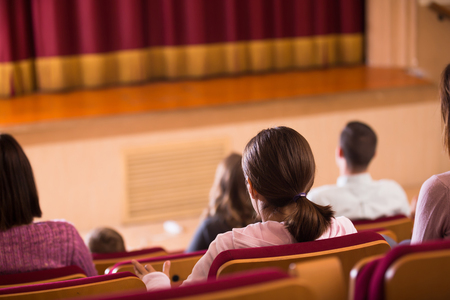 Positive audience expecting movie to begin in cinemaの写真素材