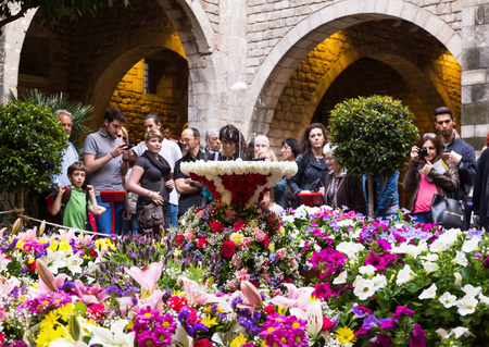 BARCELONA, SPAIN - MAY 26, 2016: People enjoying floral decorations of city celebrating Catholic Corpus Christi festival in Catalonia.のeditorial素材