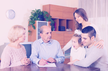 multigenerational family making shopping list together indoorの写真素材