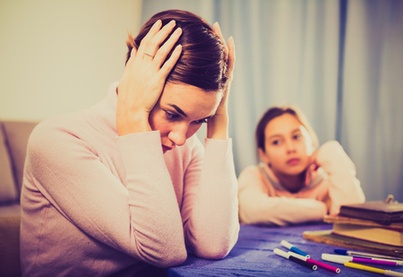 Mother is upset because of problems teaching her daughter at schoolの写真素材