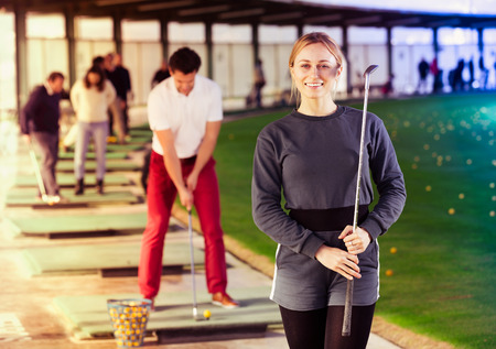 Woman golfer about to start a game on the golf courseの写真素材