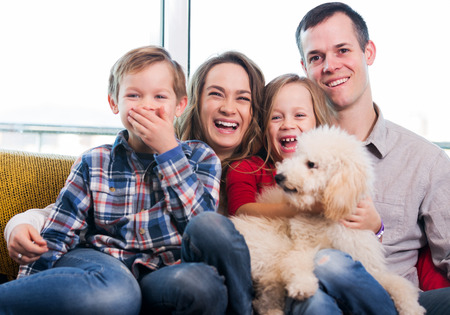 Cheerful family members spending quality time together at homeの写真素材