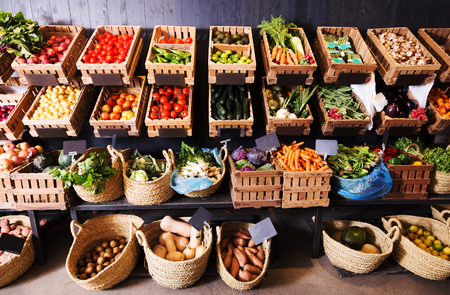 big choice of fresh fruits and vegetables on market counterの写真素材