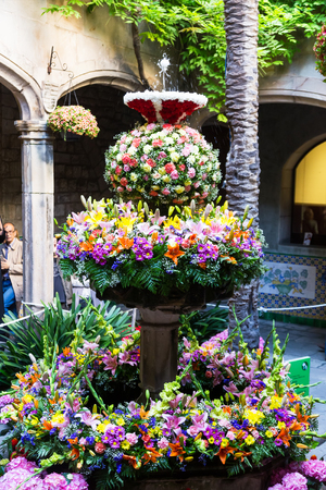BARCELONA, SPAIN - MAY 26, 2016: People enjoying floral decorations of city celebrating Catholic Corpus Christi festival in Catalonia.のeditorial素材