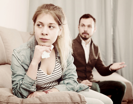 Young father quarrelling with his daughter teenager at homeの写真素材