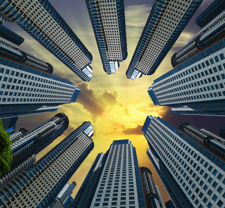 Circle of towering skyscrapers standing against clear skyの写真素材