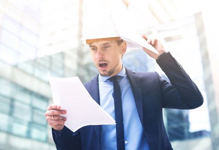 Portrait of man working outdoors and having hard workの写真素材