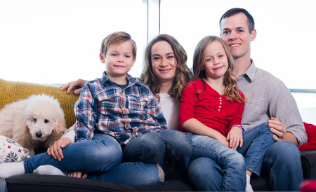 Young family enjoying evening together at homeの写真素材