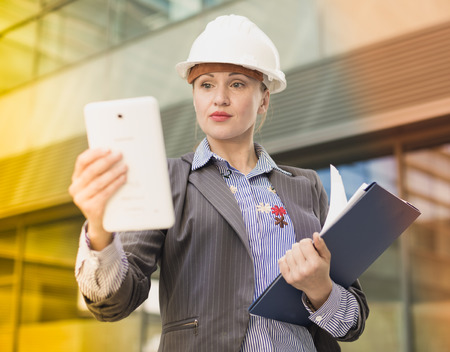 Adult woman architect working with tabletの写真素材