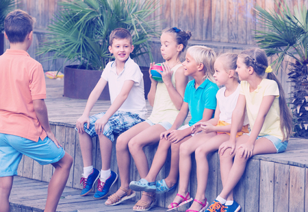 group of  kids in school age having fun playing ball togetherの写真素材
