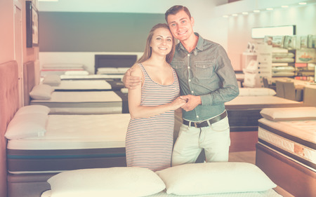 Portrait of couple choosing mattresses in the storeの写真素材