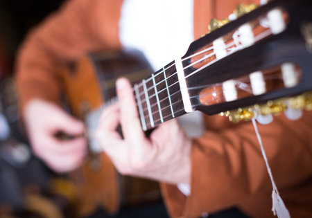 Professional guitarist practicing before the performing on guitar