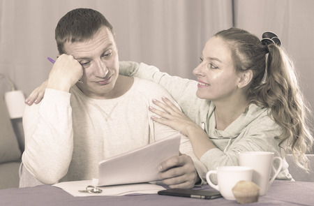 Husband and wife having no possibility to pay utility bills and rentの写真素材