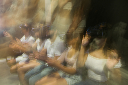 Motion blur of people having fun with new technology vr headset gogglesの写真素材