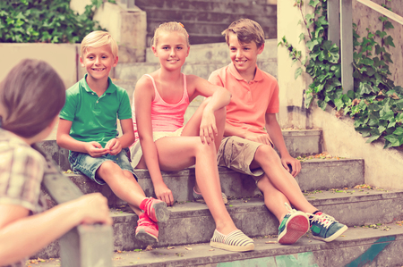 Portrait of positive children which are walking in the park.の写真素材