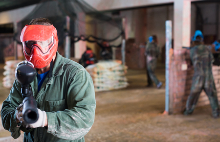 Portrait of man from red team who is targeting into enemies.の写真素材