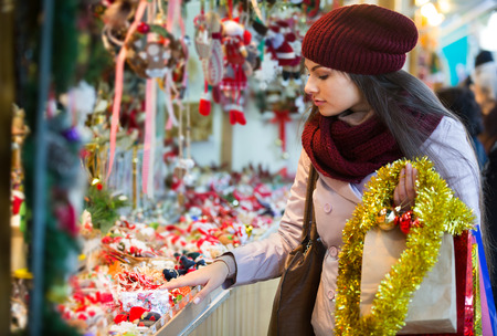 Portrait of female customer near the counter with Christmas giftsの写真素材