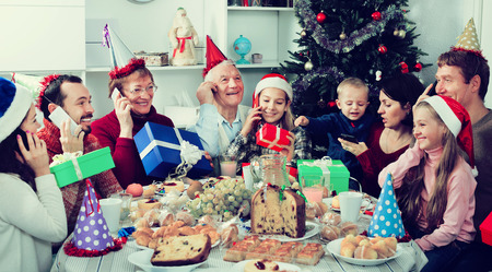 Large family happy to see each other during a delicious Christmas dinnerの写真素材