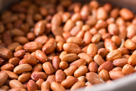 Image of brown peanut in container in the store.の写真素材