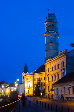 Illuminated Oradea city hall in twilight, Romaniaのeditorial素材