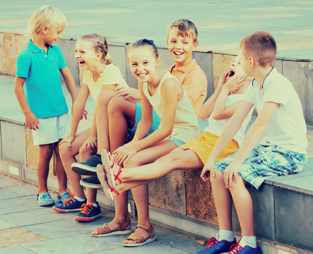 portrait of happy children spending time outside and playing charadesの写真素材