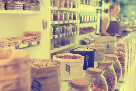 Image of showcase with dried fruits and nuts in container in the store.の写真素材