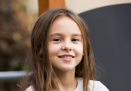 Portrait of happy girl in autumn outdoors