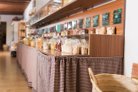 Dried fruits and nuts are on shelves in eco boutique.の写真素材