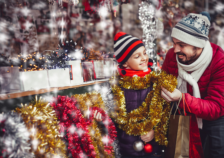 Adult with child looking for christmas presents.の写真素材