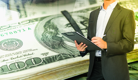 Businessman signing papers in concept of  successful profitable businessの写真素材